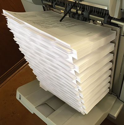 photo of collated copies coming off the printer